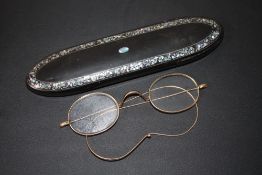 A PAIR OF GOLD RIMMED SPECTACLES IN A MOTHER OF PEARL INLAID CASE, W 15.5 cm
