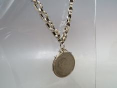AN ANTIQUE LINK SILVER WATCH CHAIN CONVERSION, with suspended Churchill coin pendant, approx.