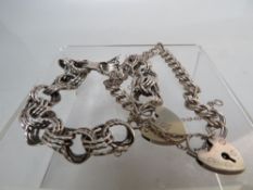TWO VINTAGE SILVER CHARM TYPE BRACELETS, approx combined weight 34.4 g (2)