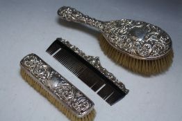 THREE HALLMARKED SILVER BRUSHES AND COMBS, various dates and makers, L 24.5 cm