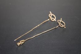 A HALLMARKED 9 CARAT GOLD STAFFORDSHIRE KNOT STICK PIN, together with an unmarked example, approx