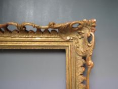 AN EARLY 20TH CENTURY CHIPPENDALE STYLE GOLD PIERCED FRAME, frame W 9 cm, frame rebate 52 x 31.5