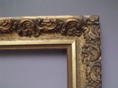 A 19TH CENTURY DECORATIVE GOLD FRAME, frame W 6.5 cm, frame rebate 33.5 cm, 38 cm