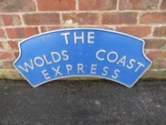 A CAST ALUMINIUM STEAM LOCOMOTIVE HEADBOARD 'THE WOLDS COAST EXPRESS', with rear metal mounting