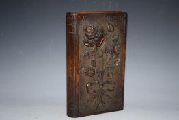 A CARVED WOODEN BOOK BOX, decorated in relief with roses and dated inside 1948, H 30 cm