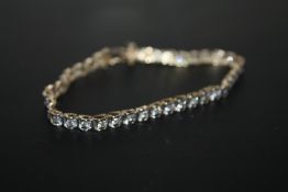 A HALLMARKED 9 CARAT GOLD DIAMOND SET 'TENNIS' BRACELET, approx weight 6.6g, L 19 cm