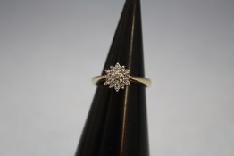 A 9 CARAT GOLD DIAMOND CLUSTER RING, approx weight 2.4g, ring size J