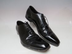 A PAIR OF PRADA BLACK LEATHER SHOES SIZE 10