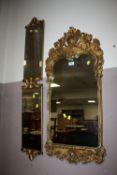 A HEAVY GILT WALL MIRROR 99 X 42 CM AND TWO FURTHER MIRRORS (3)