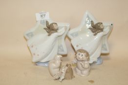 TWO NAO FIGURES OF CHERUBS TOGETHER WITH TWO STAR SHAPED NAO FIGURES