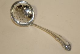A HALLMARKED SILVER SIFTER SPOON