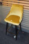 A MODERN UPHOLSTERED BAR STOOL