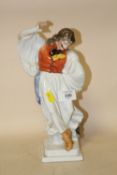 A HEREND OF HUNGARY CERAMIC DANCING FIGURE IN TRADITIONAL DRESS