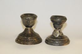 A MATCHED PAIR OF HALLMARKED SILVER SQUAT CANDLESTICK A/F
