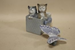 A NAO BUTTERFLY FIGURE TOGETHER WITH A NAO FIGURE OF CATS IN A BASKET