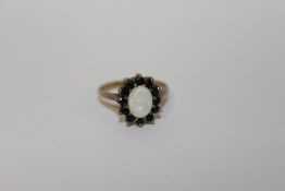 A HALLMARKED 9 CARAT GOLD OPAL SET DRESS RING APPROX WEIGHT - 2.5G