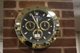 A ROLEX OYSTER PERPETUAL COSMOGRAPH WALL CLOCK WITH SWEEPER HAND WIDTH 34CM