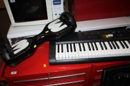 A CASIO CTK-12100 KEYBOARD A/F TOGETHER WITH MEGA MOTION WHEELS A/F