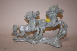 A GREEN JADE COLOURED MARBLE CARVED FIGURE OF HORSES A/F
