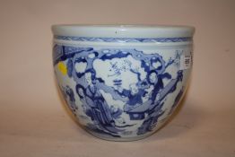 AN ORIENTAL BLUE AND WHITE CERAMIC BOWL DECORATED WITH CLASSICAL FIGURES HEIGHT 18.3 CM
