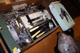 A TRAY OF KITCHENALIA TO INCLUDE A CARVING SET, SCALES AND WEIGHTS, FLATWARE ETC.