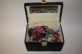 A CASKET OF COSTUME JEWELLERY