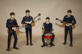 A SET OF FOUR REVELL INC. 1964 NEMS ENTERPRISES LTD. THE BEATLES FIGURES