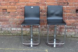 A PAIR OF MODERN SWIVEL BLACK CHROMED CHAIRS