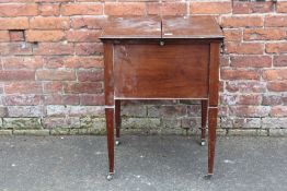 AN EARLY 20TH CENTURY MAHOGANY 'SURPRISE' DRINKS CABINET RAISED ON TREADLE LEGS H-76 W-61 CM