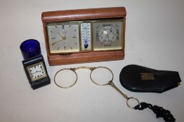 A SET OF YELLOW METAL FOLDING LORGNETTES TOGETHER WITH AND ANGELUS SENTRY TRAVELLING DESK CLOCK