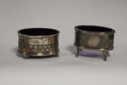 TWO HALLMARKED SILVER SALTS WITH BLUE GLASS LINERS