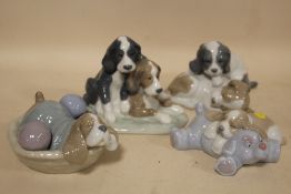 FOUR NAO FIGURES OF DOGS AND PUPPIES