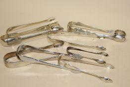 EIGHT PAIRS OF HALLMARKED SILVER SUGAR TONGS OF VARIOUS DATES AND MAKERS