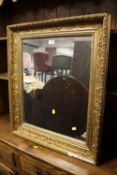 A GILT AND FOLIATE WALL MIRROR 76 X 66 CM S/D ( LOSSES TO MOULDING )