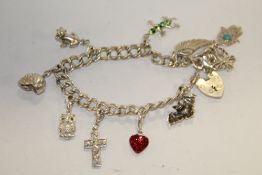 A MODERN STERLING SILVER CHARM BRACELET APPROX WEIGHT - 32G