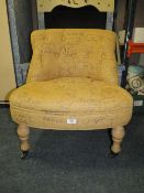 A MODERN LOW BUTTON BACKED CHAIR WITH 'SCRIPT' STYLE COVERING TOGETHER WITH A D SHAPED HALL TABLE ET