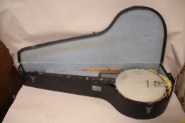 A CASED VINTAGE NEW ERA BANJO WITH MOTHER OF PEARL INLAY