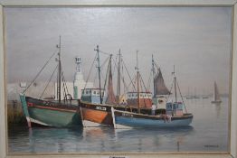 A FRAMED OIL ON BOARD ENTITLED 'BRIXHAM TRAWLERS' BY V HAMMOND - SIZE - 32 CM X 22 CM