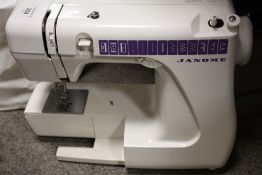 A MODERN JANOME 555 ELECTRIC SEWING MACHINE