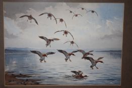 A GILT FRAMED AND GLAZED WATERCOLOUR DEPICTING DUCKS LANDING ON WATER SIGNED J C HARRISON LOWER