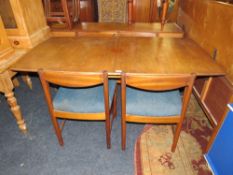 A RETRO TEAK McINTOSH DRAWLEAF DINING TABLE AND 4 CHAIRS A/F
