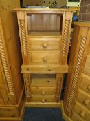 A PAIR OF PINE TWO DRAWER BEDSIDE CABINETS (2)