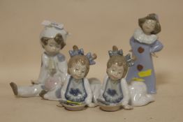 FOUR NAO FIGURES OF YOUNG CHILDREN TO INCLUDE A CHILD IN A COW COSTUME