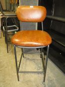 A SINGLE MODERN TAN BAR STOOL