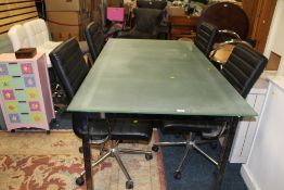 A LARGE MODERN GLASS TOPPED DINING TABLE WITH FOUR DINING CHAIRS ON CASTORS 183 X 101 CM