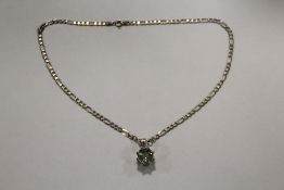 A GEM SET SILVER PENDANT ON SILVER CHAIN APPROX WEIGHT - 11.2G