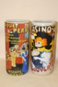 A PAIR OF MODERN CERAMIC STICK STANDS DECORATED WITH FRENCH ADVERTISING SCENES