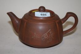 AN ORIENTAL TYPE TERRACOTTA TEAPOT, W 19 CM