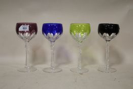 A SET OF FOUR CUT AND COLOURED WINE GLASSES