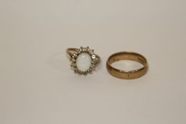 A HALLMARKED 9 CARAT GOLD WEDDING BAND, TOGETHER WITH A 9 CARAT GOLD OPAL SET DRESS RING APPROX
